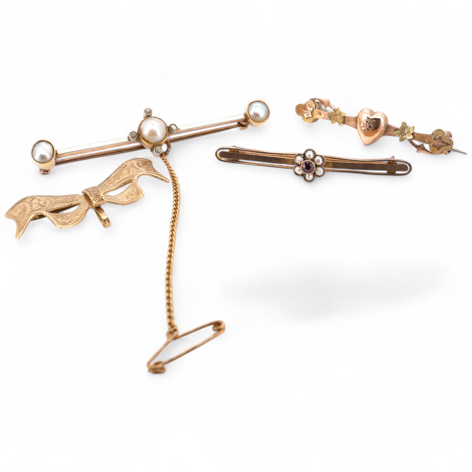 Three 9ct bar brooches, one gem set and a yellow metal split pearl and diamond chip set bar brooch, gross weight 10.1 grams.